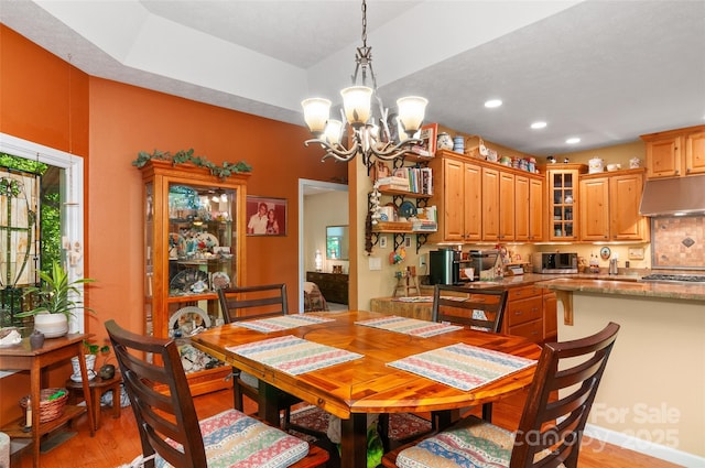 399 Stepping Stone Ln, Waynesville, NC 28786 - dining area featuring light wood finished floors, a chandelier, and recessed lighting