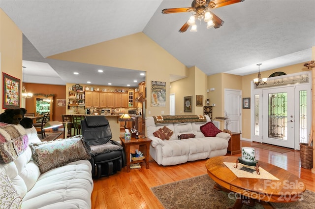 399 Stepping Stone Ln, Waynesville, NC 28786 - living area with a chandelier, high vaulted ceiling, light wood finished floors, a ceiling fan, and recessed lighting