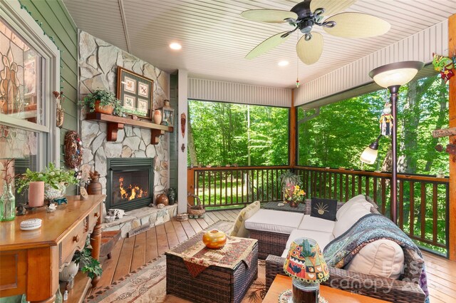 399 Stepping Stone Ln, Waynesville, NC 28786 - sunroom featuring ceiling fan and an outdoor living space with a fireplace