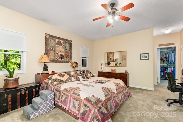 399 Stepping Stone Ln, Waynesville, NC 28786 - carpeted bedroom featuring a walk in closet, a ceiling fan, a closet, and a desk