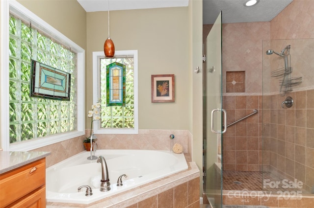 399 Stepping Stone Ln, Waynesville, NC 28786 - bathroom with a garden tub, a shower stall, healthy amount of natural light, and vanity