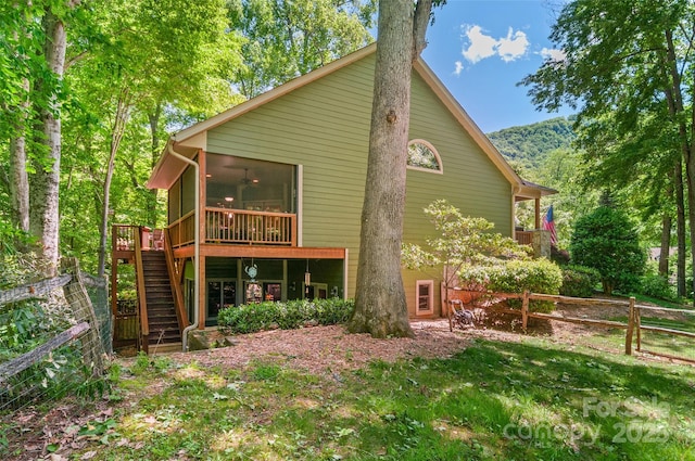 399 Stepping Stone Ln, Waynesville, NC 28786 - back of house with stairs, a sunroom, a deck, and a ceiling fan