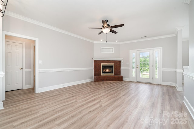 6201 New Hope Church Rd, Marshville, NC 28103 - unfurnished living room featuring a brick fireplace, ceiling fan, light wood finished floors, crown molding, and baseboards