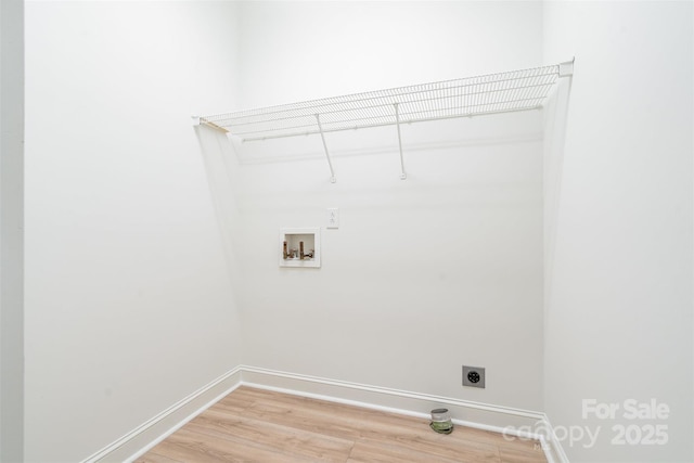 6201 New Hope Church Rd, Marshville, NC 28103 - washroom featuring hookup for an electric dryer, washer hookup, light wood-style flooring, and baseboards