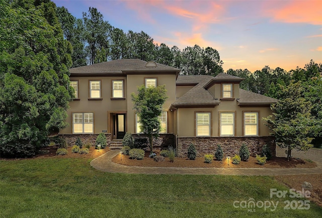 11052 Preservation Park Dr, Charlotte, NC 28214 - view of front of property with stucco siding, a front lawn, stone siding, and roof with shingles