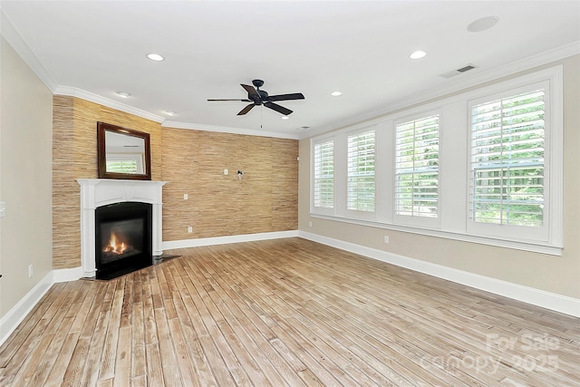 11052 Preservation Park Dr, Charlotte, NC 28214 - unfurnished living room featuring light wood-type flooring, baseboards, plenty of natural light, a ceiling fan, and ornamental molding