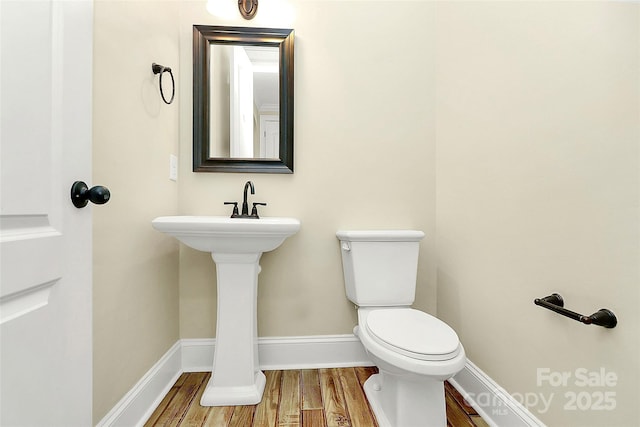 11052 Preservation Park Dr, Charlotte, NC 28214 - half bath featuring wood finished floors, toilet, and baseboards