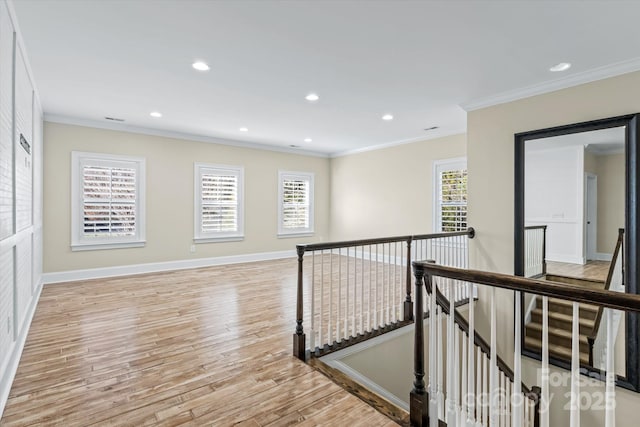 11052 Preservation Park Dr, Charlotte, NC 28214 - hall featuring an upstairs landing, light wood-type flooring, ornamental molding, baseboards, and recessed lighting