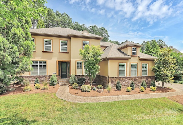 11052 Preservation Park Dr, Charlotte, NC 28214 - view of front facade featuring stucco siding, stone siding, a front lawn, and a shingled roof