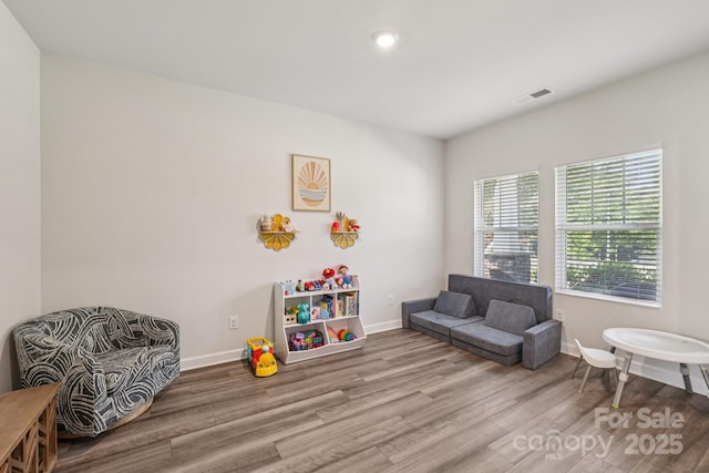 15023 Longmoore Dr, Charlotte, NC 28278 - living area with wood finished floors, baseboards, and recessed lighting