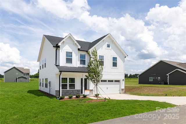 32616 Millingport Rd Unit 7144, New London, NC 28127 - view of front of home with board and batten siding, concrete driveway, and a front yard