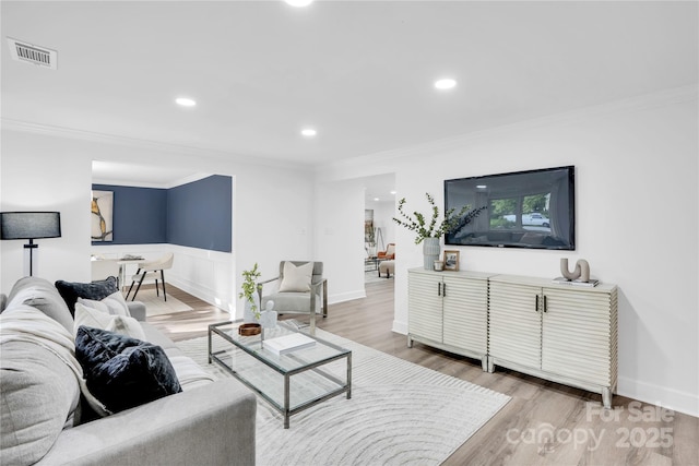 9826 Meringue Pl Unit 15, Charlotte, NC 28270 - living room featuring ornamental molding, light wood-style floors, a wainscoted wall, and recessed lighting
