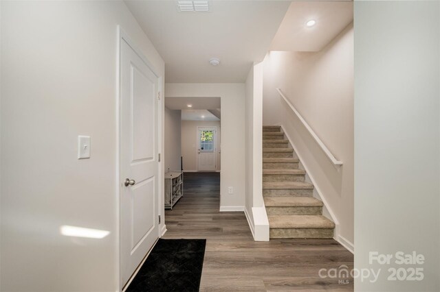 2037 Langer St, Charlotte, NC 28214 - stairs featuring wood finished floors, recessed lighting, and baseboards