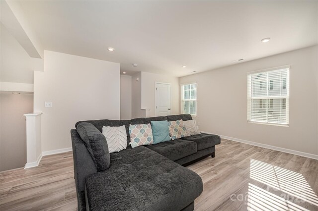2037 Langer St, Charlotte, NC 28214 - living room featuring light wood-style flooring, plenty of natural light, baseboards, and recessed lighting
