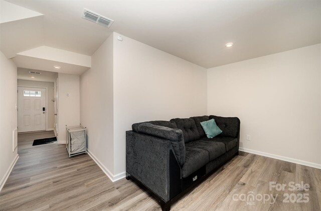 2037 Langer St, Charlotte, NC 28214 - living area featuring light wood-style floors, baseboards, and recessed lighting