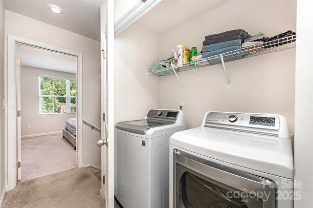 2037 Langer St, Charlotte, NC 28214 - washroom with washing machine and dryer, light carpet, and baseboards