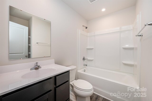 2037 Langer St, Charlotte, NC 28214 - full bath featuring vanity, toilet, tub / shower combination, and wood finished floors