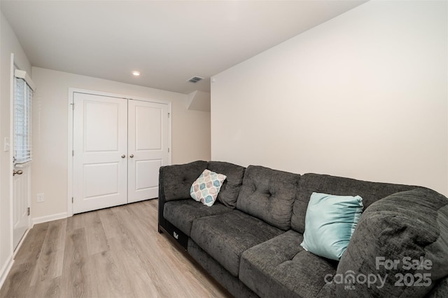 2037 Langer St, Charlotte, NC 28214 - living area featuring light wood-type flooring, baseboards, and recessed lighting