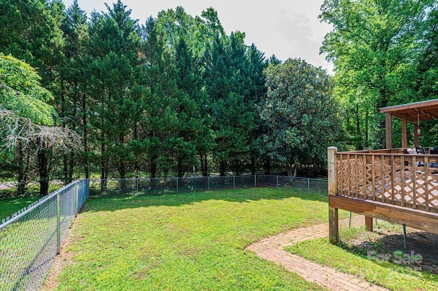 view of yard featuring a wooden deck