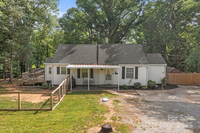 800 Woodlawn St, Belmont, NC 28012 - view of front of home with a chimney, roof with shingles, a deck, and view of wooded area