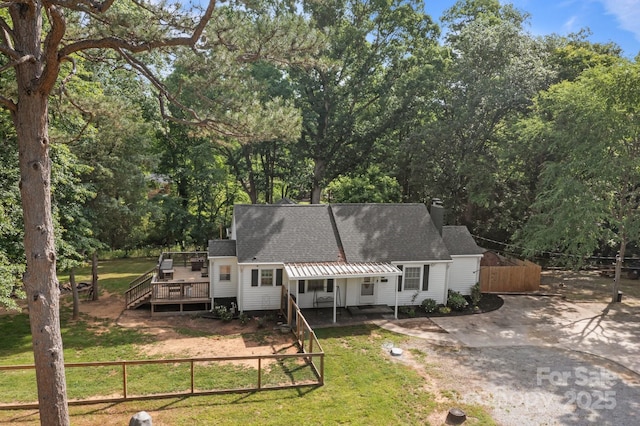 800 Woodlawn St, Belmont, NC 28012 - back of house featuring roof with shingles, a wooden deck, and view of scattered trees