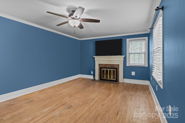 800 Woodlawn St, Belmont, NC 28012 - unfurnished living room featuring wood finished floors, a brick fireplace, ceiling fan, and crown molding