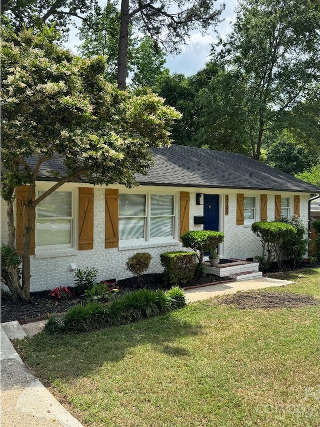 3700 Denson Pl, Charlotte, NC 28215 - ranch-style house featuring a front lawn, brick siding, and roof with shingles