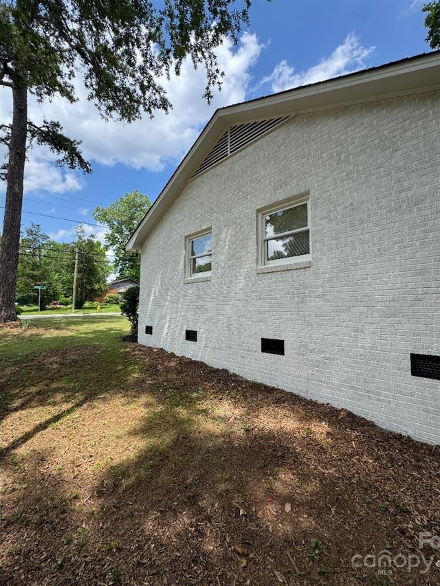 3700 Denson Pl, Charlotte, NC 28215 - view of side of property with crawl space, brick siding, and a lawn