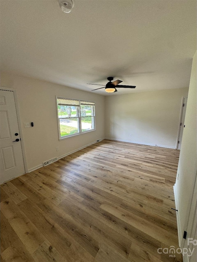 3700 Denson Pl, Charlotte, NC 28215 - empty room featuring ceiling fan, wood finished floors, and baseboards