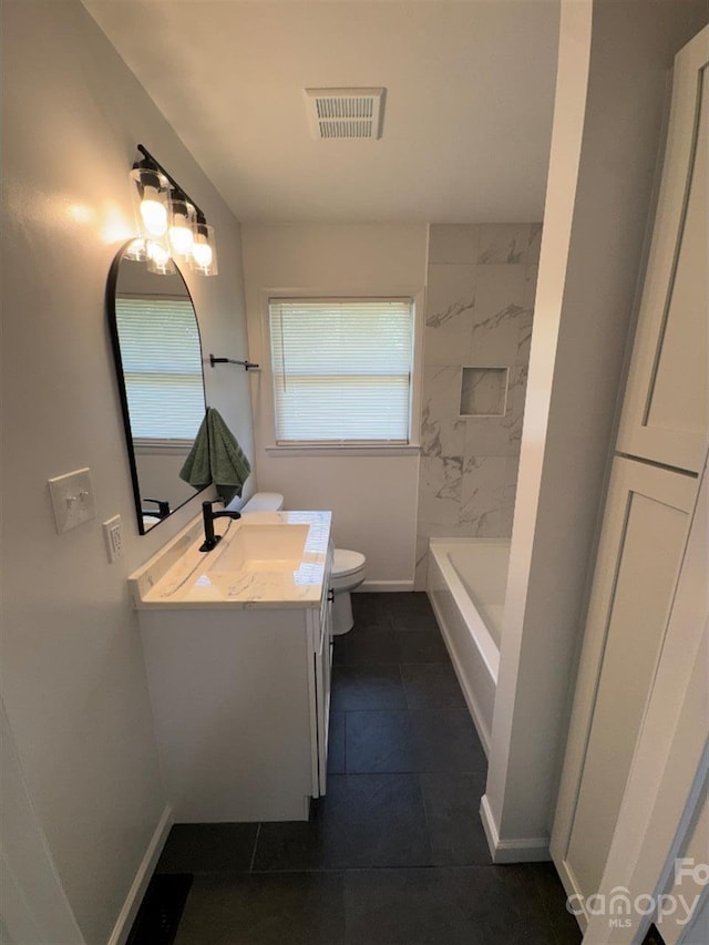 3700 Denson Pl, Charlotte, NC 28215 - bathroom with toilet, vanity, baseboards, and tile patterned floors