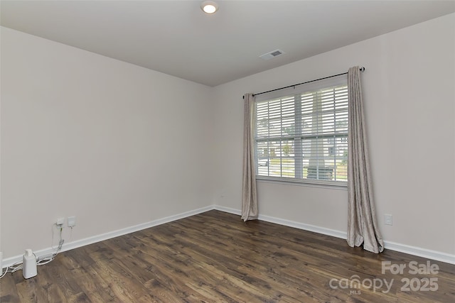 9505 Cotswood Pl, Gastonia, NC 28056 - spare room featuring dark wood-style floors and baseboards