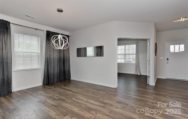 9505 Cotswood Pl, Gastonia, NC 28056 - unfurnished dining area with a chandelier, wood finished floors, and healthy amount of natural light