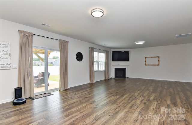 9505 Cotswood Pl, Gastonia, NC 28056 - unfurnished living room featuring dark wood finished floors and a fireplace