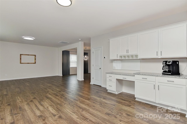 9505 Cotswood Pl, Gastonia, NC 28056 - kitchen with dark wood-type flooring, white cabinets, light stone countertops, and open floor plan