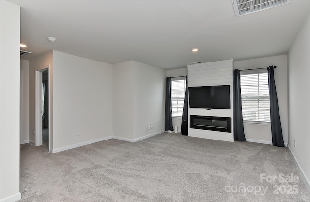 9505 Cotswood Pl, Gastonia, NC 28056 - unfurnished living room featuring carpet floors, healthy amount of natural light, and recessed lighting