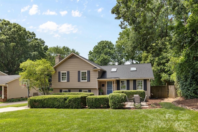 4024 Tyndale Ave, Charlotte, NC 28210 - split level home with a chimney