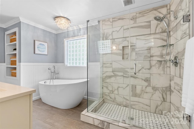 4024 Tyndale Ave, Charlotte, NC 28210 - bathroom featuring a freestanding tub, a stall shower, vanity, crown molding, and wainscoting