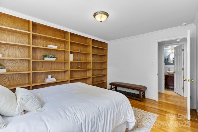 4024 Tyndale Ave, Charlotte, NC 28210 - bedroom featuring ornamental molding, light wood finished floors, baseboards, and a sink