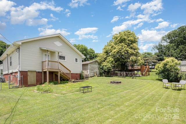 380 Woodlawn Ave, Cramerton, NC 28032 - view of yard featuring a fire pit, stairs, and a wooden deck