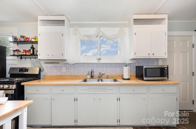 380 Woodlawn Ave, Cramerton, NC 28032 - kitchen featuring stainless steel microwave, white cabinets, light countertops, and ornamental molding