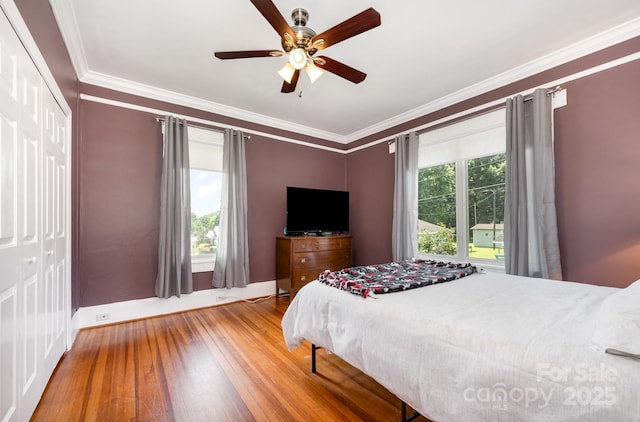 380 Woodlawn Ave, Cramerton, NC 28032 - bedroom with wood finished floors, ornamental molding, a closet, and a ceiling fan
