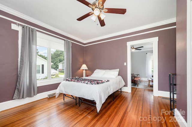 380 Woodlawn Ave, Cramerton, NC 28032 - bedroom featuring crown molding, wood finished floors, and a ceiling fan