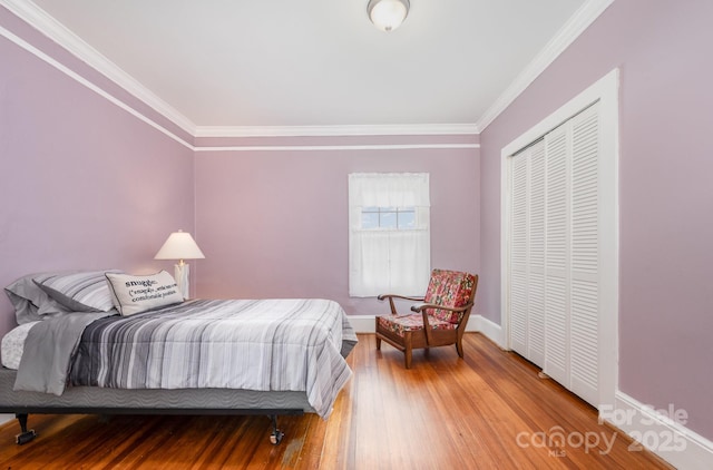 380 Woodlawn Ave, Cramerton, NC 28032 - bedroom featuring crown molding, wood finished floors, and a closet