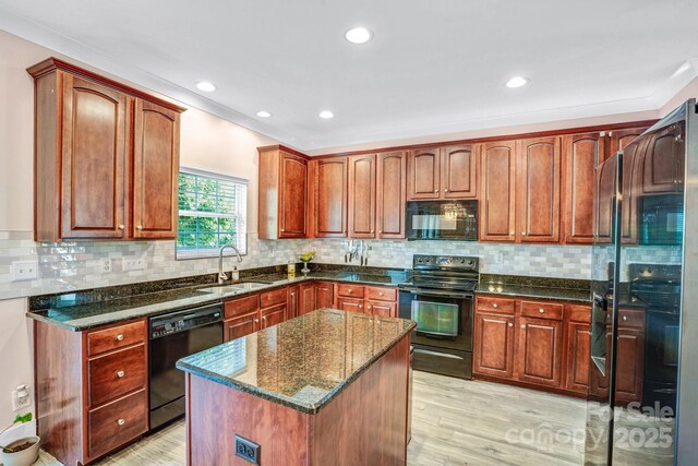 1503 Stoney Ct, York, SC 29745 - kitchen featuring black appliances, a sink, light wood finished floors, dark stone countertops, and recessed lighting
