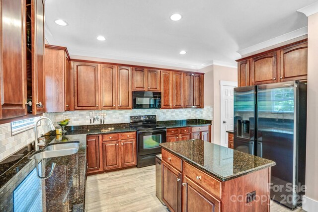 1503 Stoney Ct, York, SC 29745 - kitchen featuring black appliances, a sink, crown molding, decorative backsplash, and a center island