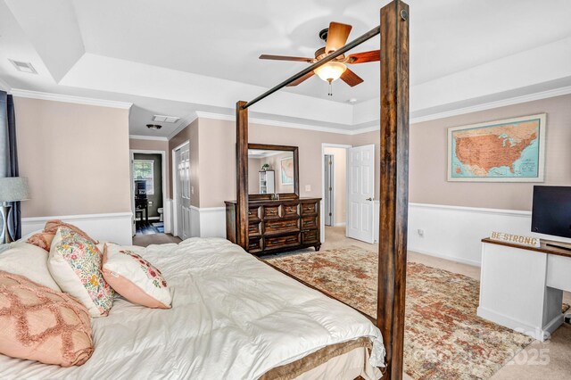 1503 Stoney Ct, York, SC 29745 - carpeted bedroom featuring a tray ceiling, crown molding, a wainscoted wall, and ceiling fan