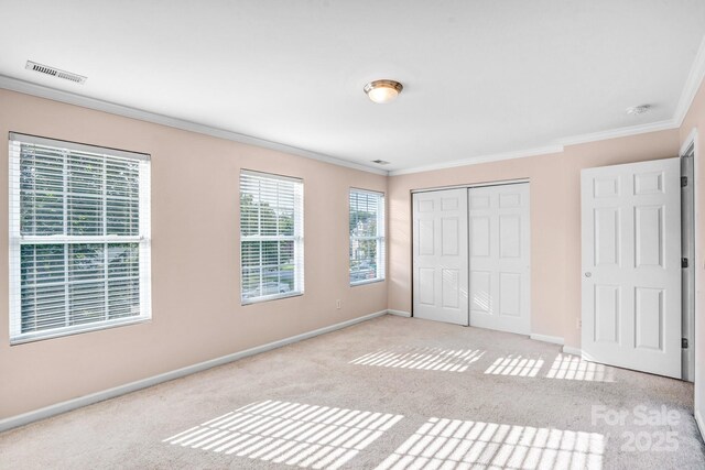 1503 Stoney Ct, York, SC 29745 - unfurnished bedroom featuring ornamental molding, baseboards, light carpet, and a closet