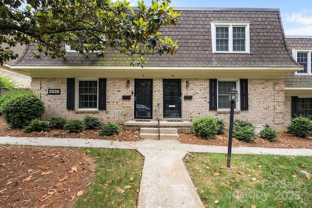3528 Colony Rd Unit A, Charlotte, NC 28211 - view of front facade with mansard roof and brick siding