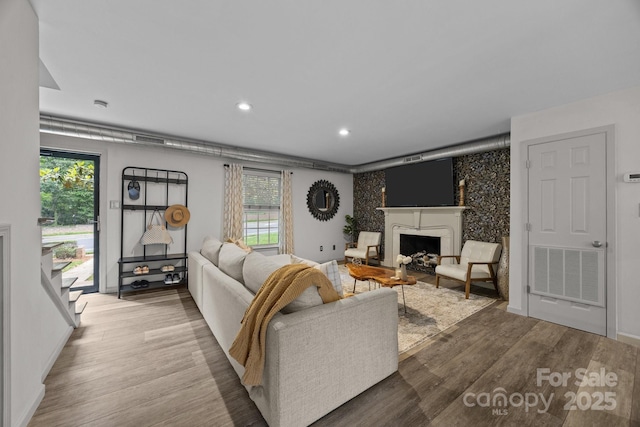 3528 Colony Rd Unit A, Charlotte, NC 28211 - living room featuring wood finished floors, a fireplace, recessed lighting, and baseboards