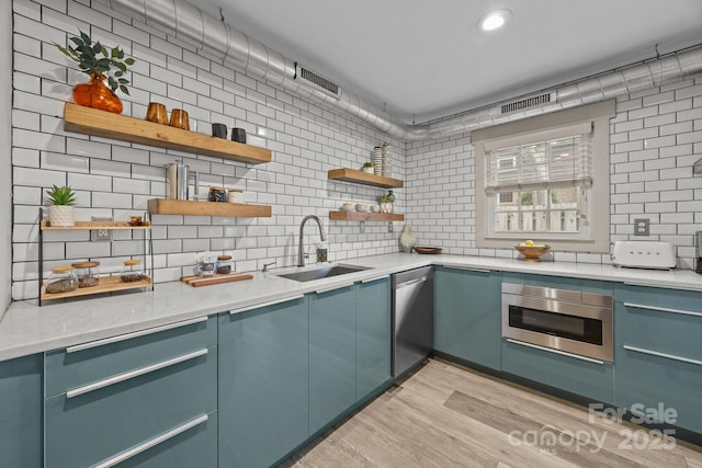 3528 Colony Rd Unit A, Charlotte, NC 28211 - kitchen with a sink, open shelves, wall oven, decorative backsplash, and recessed lighting